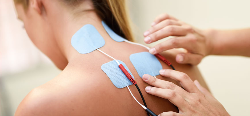 Female patient recieving electrical muscle stimulation for neck pain relief